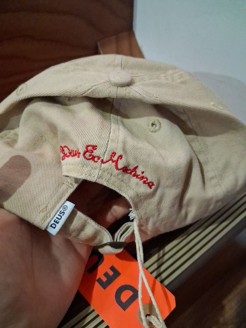 Deus Ex Machina Relief Dad Cap Brown Red (Category: Caps & Hats) located in Quezon City. Submitted by 357oclock (Listing ID 1470757016, Image 3). Description: - Brand: Deus Ex Machina - Condition: Brand new with original tags attached - Color: Brown and red - Design: Classic curved brim with embroidered logo on front and text embroidery on back strap - Closure: Adjustable metal clasp.