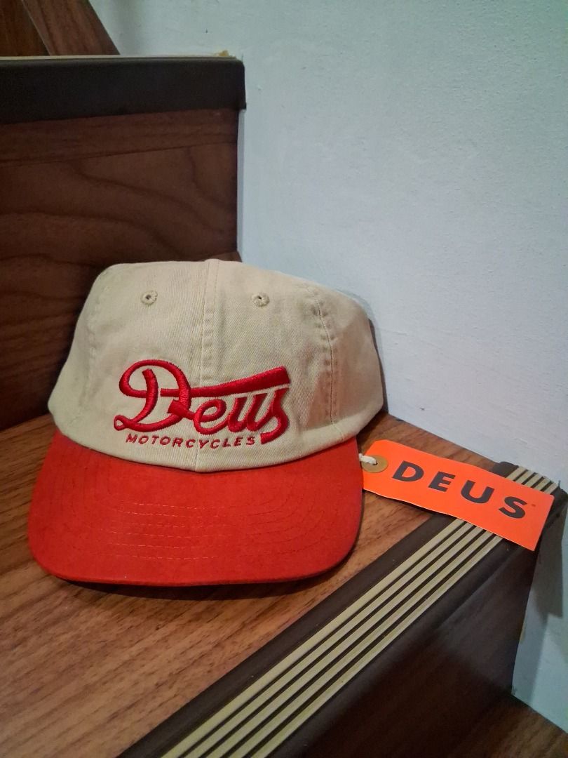 Deus Ex Machina Relief Dad Cap Brown Red (Category: Caps & Hats) located in Quezon City. Submitted by 357oclock (Listing ID 1470757016, Image 1). Description: - Brand: Deus Ex Machina - Condition: Brand new with original tags attached - Color: Brown and red - Design: Classic curved brim with embroidered logo on front and text embroidery on back strap - Closure: Adjustable metal clasp.