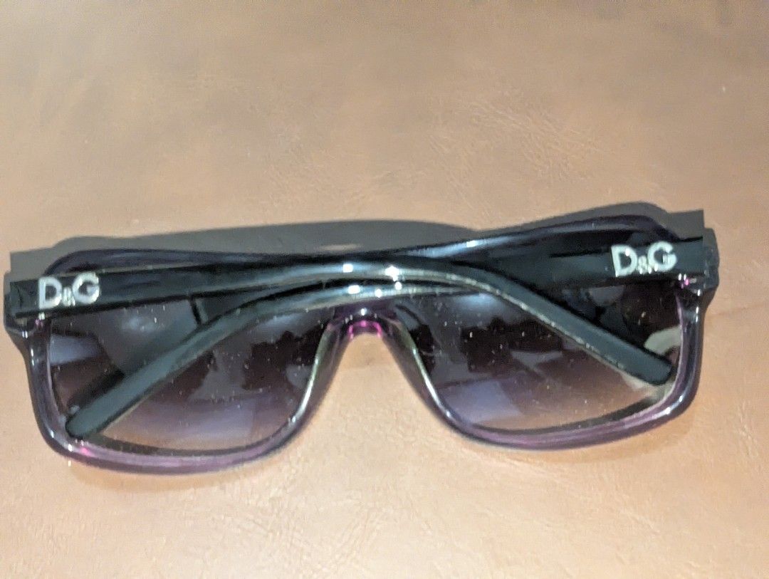 D&G Dolce & Gabbana 8068 Sunglasses (Category: Sunglasses & Eyewear) located in Manila. Submitted by _neku (Listing ID 1470743671, Image 2). Description: - Brand: D&G Dolce & Gabbana - Model: 8068 (1525/33), Made in Italy - Style: Bold square frame in purple with dark gradient lenses - Details: Distinctive metal D&G logo lettering on both temples - Dimensions: Lens 61mm, Bridge 13mm, Temple 130mm - Condition: Excellent designer eyewear ready to w