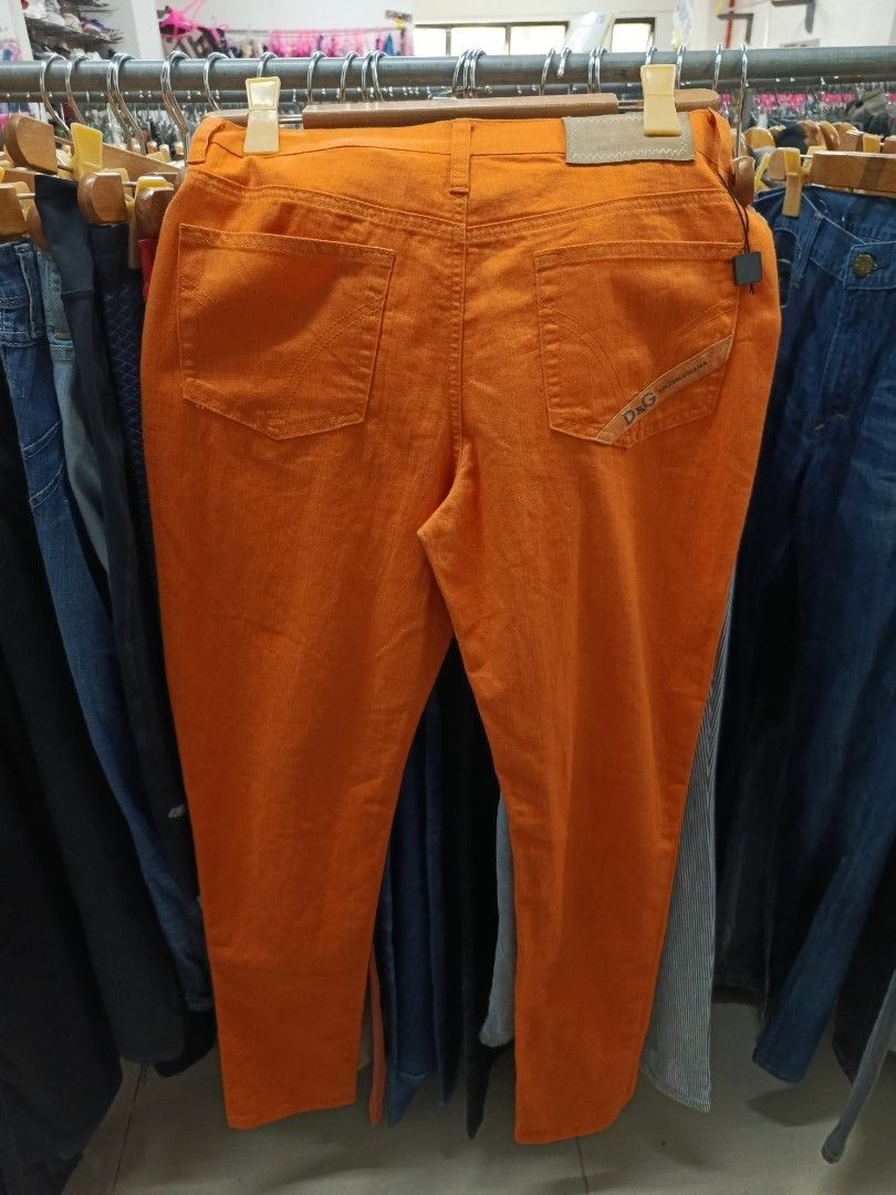 D&G Orange Slim Jeans (Category: Jeans) located in Cabatuan. Submitted by penthegreat (Listing ID 1470836521, Image 2). Description: Dimes: 15.5 width, 6 hem, 41 length - Brand: D&G (Dolce & Gabbana) - Color: Vibrant orange - Origin: Made in Italy - Design: Classic five-pocket style with branded buttons and rivets - Details: Branded black inner waistband label - Style Tip: Great standout piece for a casual outfit.