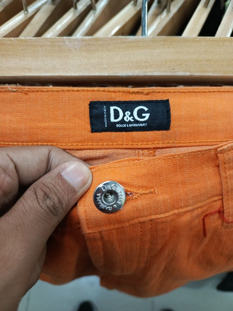 D&G Orange Slim Jeans (Category: Jeans) located in Cabatuan. Submitted by penthegreat (Listing ID 1470836521, Image 3). Description: Dimes: 15.5 width, 6 hem, 41 length - Brand: D&G (Dolce & Gabbana) - Color: Vibrant orange - Origin: Made in Italy - Design: Classic five-pocket style with branded buttons and rivets - Details: Branded black inner waistband label - Style Tip: Great standout piece for a casual outfit.