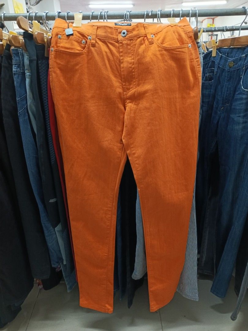 D&G Orange Slim Jeans (Category: Jeans) located in Cabatuan. Submitted by penthegreat (Listing ID 1470836521, Image 1). Description: Dimes: 15.5 width, 6 hem, 41 length - Brand: D&G (Dolce & Gabbana) - Color: Vibrant orange - Origin: Made in Italy - Design: Classic five-pocket style with branded buttons and rivets - Details: Branded black inner waistband label - Style Tip: Great standout piece for a casual outfit.