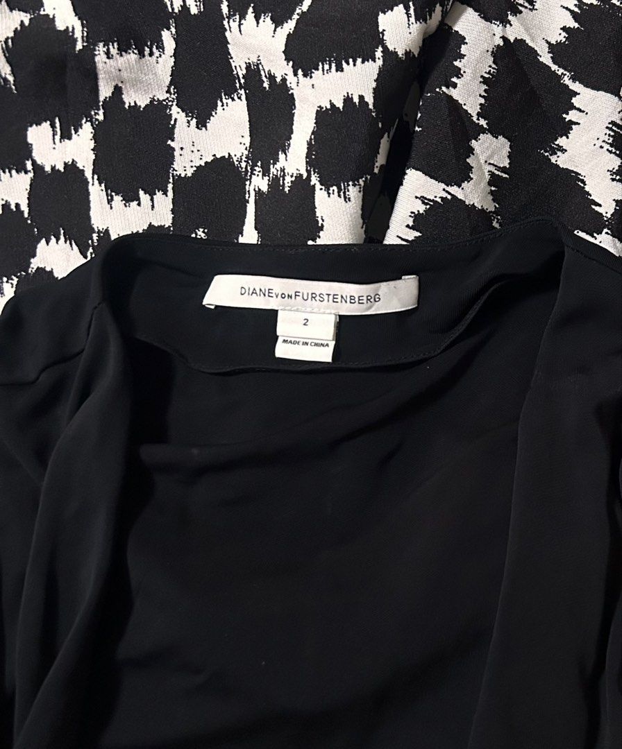 DIANE VON FURSTENBERG (Category: Dresses) located in Davao. Submitted by sart0ria85 (Listing ID 1470776610, Image 3). Description: This AMELIA wrap dress is signature to the house of DVF in deep Black jersey top in V-neckline and long sleeves. Textured black and white pattern in skirt. 66%POLYESTER 16% RAYON 19%NYLON MADE IN CHINA 🇨🇳 XSMALL. Size 2 EXCELLENT CONDITION (98/100).