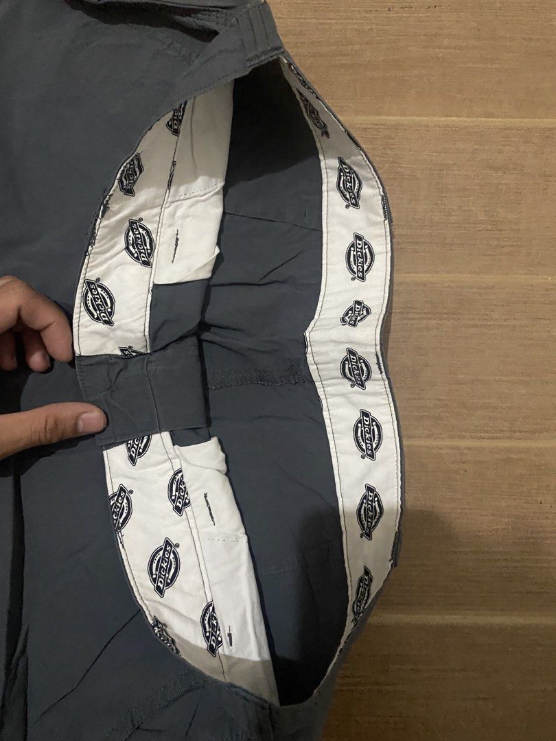 Dickies Dark Grey Nylon Carpenter Pants Size 32 (Category: Trousers) located in Bacoor. Submitted by galawangsosa (Listing ID 1470874974, Image 2). Description: - Brand: Dickies - Color: Dark Grey - Size: 32 (Fits 175/80A) - Material: 64% cotton, 32% nylon, 4% spandex (100% cotton pocket lining) - Fit: Straight leg cut - Features: Multiple utility pockets including rear cargo pockets, branded interior waistband lining, and iconic rear Dickies log