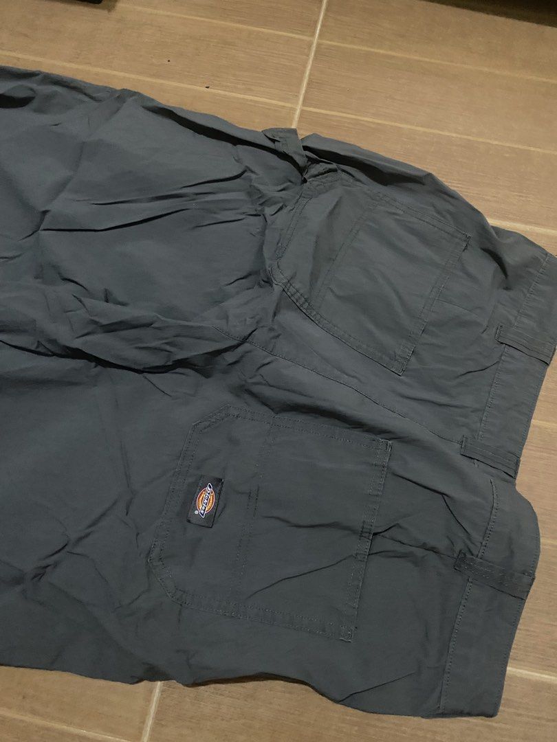 Dickies Dark Grey Nylon Carpenter Pants Size 32 (Category: Trousers) located in Bacoor. Submitted by galawangsosa (Listing ID 1470874974, Image 3). Description: - Brand: Dickies - Color: Dark Grey - Size: 32 (Fits 175/80A) - Material: 64% cotton, 32% nylon, 4% spandex (100% cotton pocket lining) - Fit: Straight leg cut - Features: Multiple utility pockets including rear cargo pockets, branded interior waistband lining, and iconic rear Dickies log
