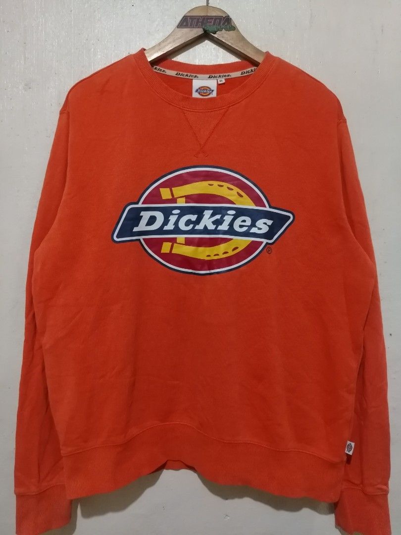 Dickies Orange Logo Sweatshirt (Category: Coats, Jackets and Outerwear) located in Rizal. Submitted by gmpastoffi75031 (Listing ID 1470790831, Image 1). Description: - Brand: Dickies - dimes 24x28 - Color: Bright orange - Size: XL - Material: Thick, warm cotton fleece - Design: Iconic chest logo graphic and classic V-stitch collar - Fit: Ribbed cuffs and hem to maintain shape - Condition: Ready to wear with minor wrinkling from storage.