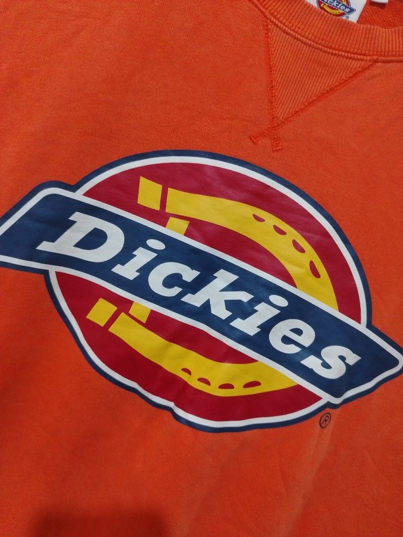 Dickies Orange Logo Sweatshirt (Category: Coats, Jackets and Outerwear) located in Rizal. Submitted by gmpastoffi75031 (Listing ID 1470790831, Image 2). Description: - Brand: Dickies - dimes 24x28 - Color: Bright orange - Size: XL - Material: Thick, warm cotton fleece - Design: Iconic chest logo graphic and classic V-stitch collar - Fit: Ribbed cuffs and hem to maintain shape - Condition: Ready to wear with minor wrinkling from storage.