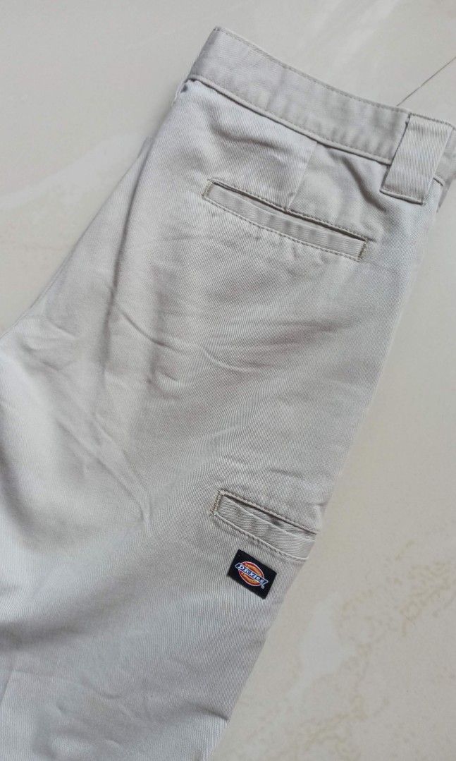 Dickies Skinny Straight Beige Pants (Category: Jeans) located in Santa Teresita. Submitted by icecandy2.0 (Listing ID 1470824187, Image 3). Description: - Brand: Dickies - Style: Skinny straight trousers / Workwear - Color: Beige - Waist: Approx. 15 inches across - Details: Belt loops, zip fly, button closure, signature logo labeling inside waistband - Condition: Good overall, with a small rip near the upper leg area.