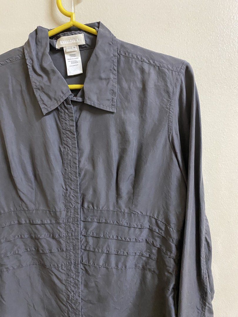 Diesel Grey Silk Long Sleeve Blouse (Category: Blouses) located in Makati City. Submitted by pepperstoremerch (Listing ID 1470930368, Image 2). Description: Diesel Grey Silk Long Sleeve Blouse Size Medium 100% Silk Preloved, good condition Please see pictures D0126 P261029HS.