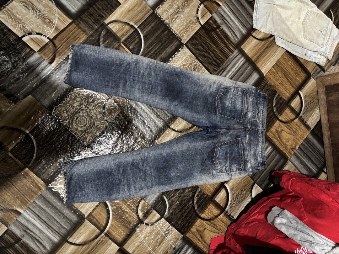 Dior Homme Distressed Denim Jeans (Category: Jeans) located in Lopez. Submitted by thrift.ni.roms22 (Listing ID 1470771364, Image 2). Description: - Authentic Dior Homme washed denim jeans - Classic straight leg cut with heavy factory distressing and fading - Branded hardware featuring Dior Homme engraved closures - Iconic CD logo metal detail on the back belt loop - Interior leather Dior tag at the inner waistband - Classic blue wash tone with s
