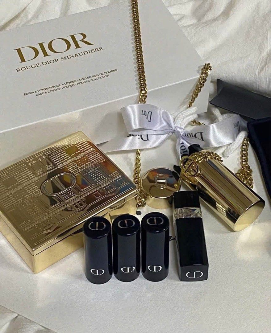 Dior Rouge Dior Minaudiere Lipstick Set (Category: Makeup) located in Leyte. Submitted by modernpersephone (Listing ID 1470823423, Image 2). Description: - Authentic Dior holiday makeup collection in brand new, unused condition - Includes a stunning gold clutch case with a removable chain strap - Comes with 4 refillable lipsticks in different shades and finishes - Beautifully packaged with its original presentation box and white ribbon - All orig