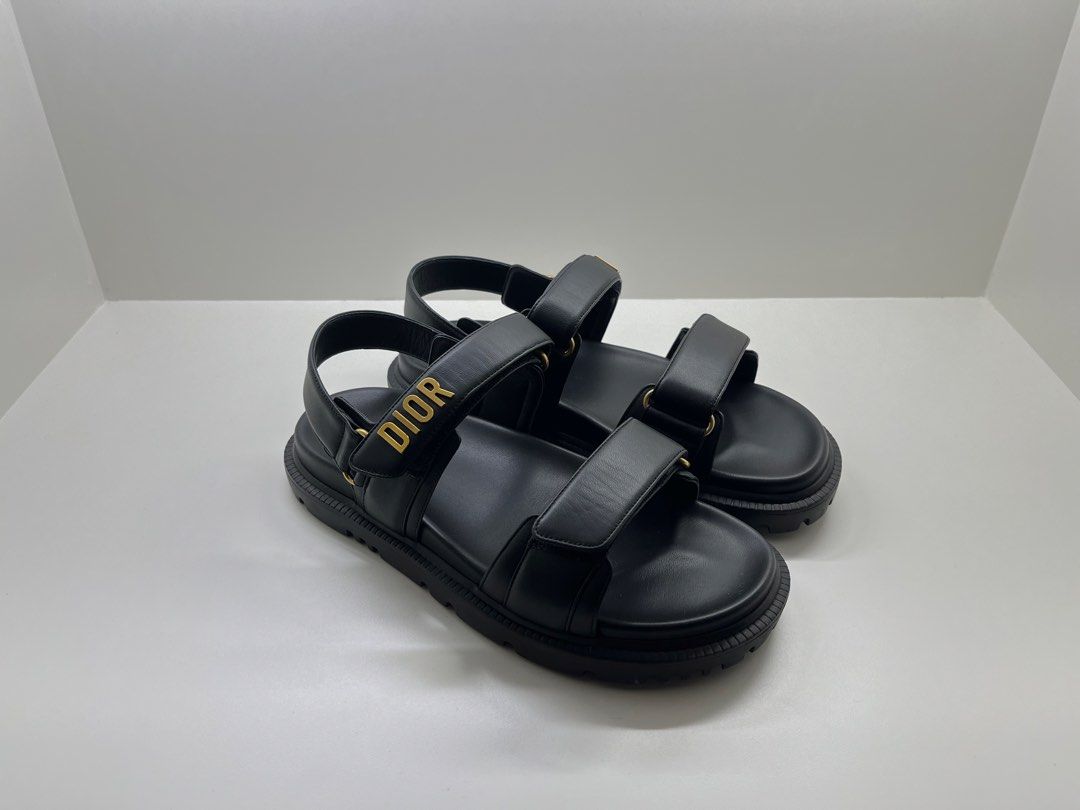Dioract Black Leather Sandals (Category: Sneakers & Footwear) located in Bacolod City. Submitted by silvermannequin (Listing ID 1470862866, Image 1). Description: - Brand: Dior - Style: Chunky lug sole sandals with bold gold DIOR lettering - Color: Classic black with gold-tone hardware - Material: Premium smooth leather - Closure: Double hook and loop velcro straps for an adjustable fit - Condition: Clean and excellent, no scuffs or marks - Desig