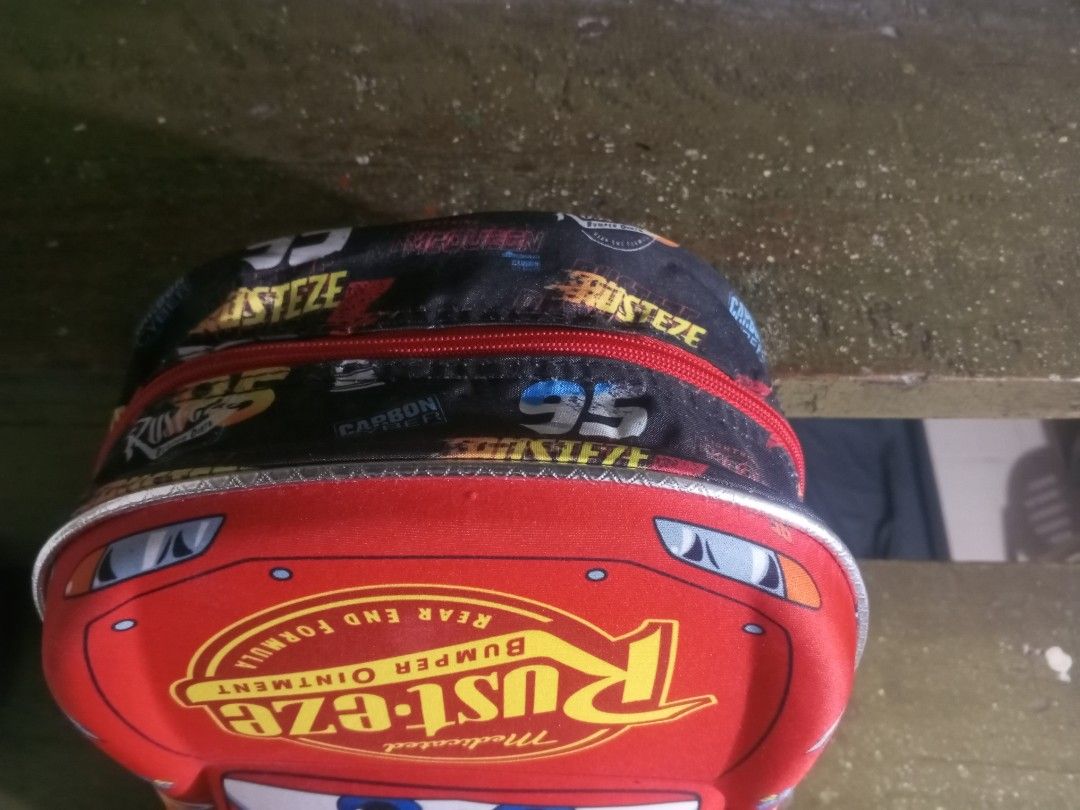 Disney Pixar Cars Lightning McQueen Backpack 95 (Category: Backpacks) located in Pasig City. Submitted by ryuzakiray80620 (Listing ID 1470874286, Image 3). Description: Original price mall 799 - Official Disney Pixar Cars Lightning McQueen kids backpack - Vibrant red molded front featuring iconic number 95 and Rust-eze graphics - Cool black side panels with racing prints and logos - Bright red zipper with a metallic key-shaped Disney Cars branded