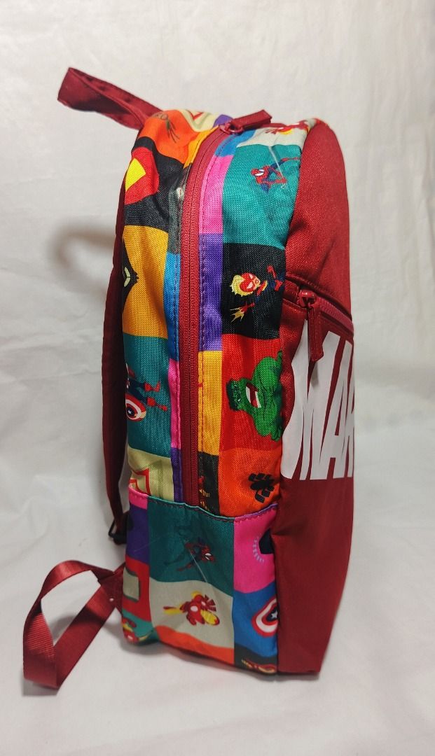 DIsneyland Marvel Superhero Comic Print Backpack Red (Category: Backpacks) located in Baguio. Submitted by jdm.rvr24 (Listing ID 1470877307, Image 2). Description: *actual pictures posted* brand: MARVEL dimension in inches; height: 17 length: 10.5 width / thickness: 4.5 division: 1 main zip, 1 front zip material: canvas actual color: red color rate: 10/10 lock type: zipper working all zips adjustable back straps condition: very good Reminder: Uka