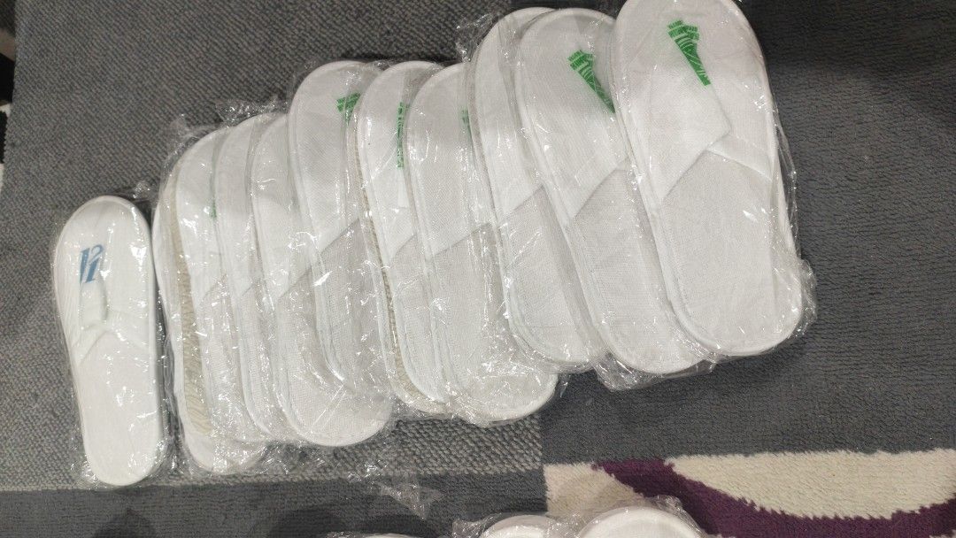Disposable white Hotel slippers (Category: Slippers & Slides) located in Manila. Submitted by aaronpaula05546 (Listing ID 1470848075, Image 2). Description: -product: white disposable hotel slippers -packaging:individualy in a plastic for hygiene -design plain ,clean,minimalist look -material soft and lightweight for -comfortable indoor wear -perfect for house guest. travel. spa days. and staycations 18pairs.
