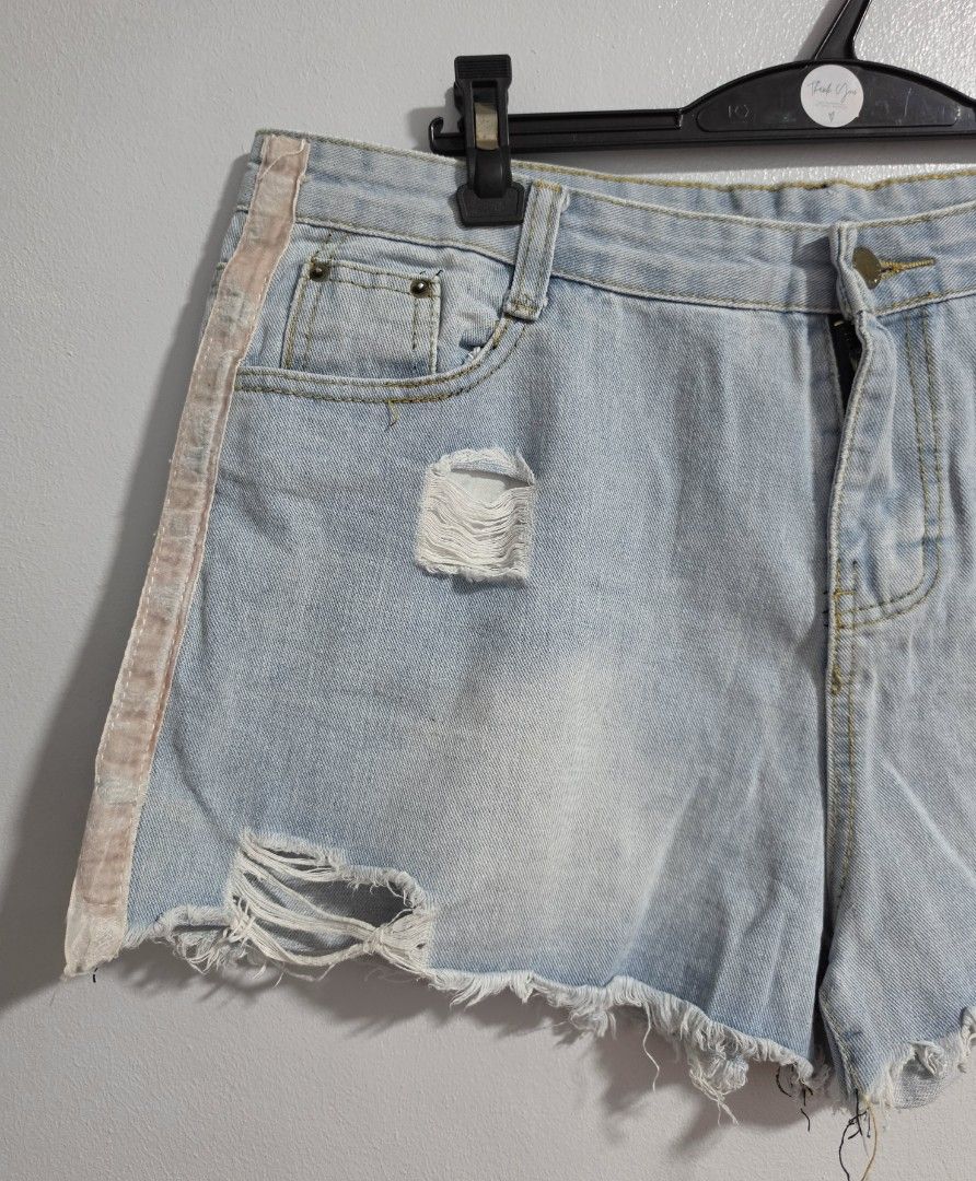 Distressed Light Wash Denim Shorts with Side Stripe (Category: Shorts) located in Paranaque City. Submitted by franinnashop (Listing ID 1470850269, Image 3). Description: Declutter - Style: Light wash denim shorts with distressed front rips and frayed raw hems - Detail: Unique faded pink side stripes on both legs - Closure & Fit: Button fly with belt loops - Pockets: Classic 5-pocket design (two front, one coin, two back patch) - Measurements: Wa