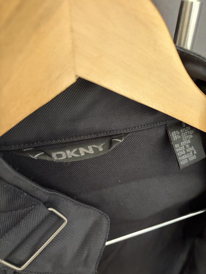 DKNY Black Nylon Cotton Blend Moto Jacket Size S (Category: Coats, Jackets and Outerwear) located in Urdaneta. Submitted by theoldmanstore (Listing ID 1470747480, Image 3). Description: - Brand: DKNY - Style: Moto jacket with minimal hardware - Size: S - Material: 65% nylon, 35% cotton - Color: Black - Features: Diagonal front zipper, stand collar with buckle strap, zip chest pocket, and sleeve zip details.