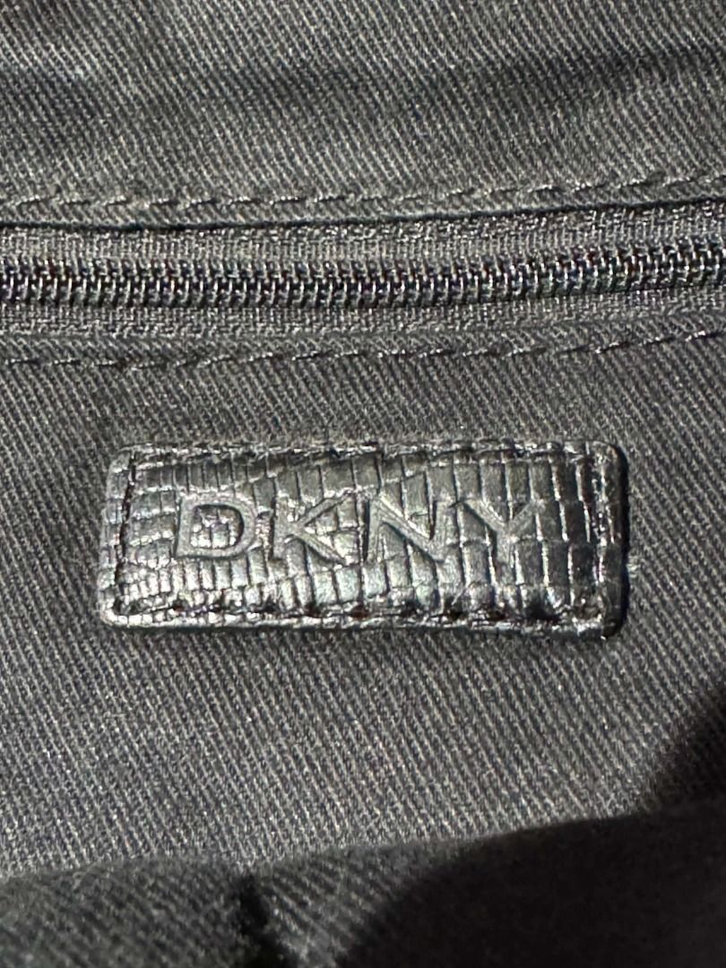 DKNY Black Structured Handbag with Monogram Print (Category: Luxury Bags & Wallets) located in Caloocan City. Submitted by deo0215 (Listing ID 1470798619, Image 3). Description: Authentic Vintage DKNY Monogram Jacquard Satchel / Bowling Bag ✨ The ultimate Y2K archival piece! Up for grabs is a beautiful vintage Donna Karan New York (DKNY) monogram satchel in a sleek black-on-black colorway. Condition Details: • Exterior: Excellent vintage conditio
