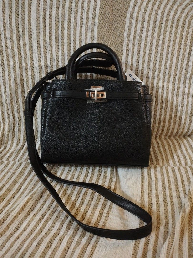 DKNY Onya crossbody bag (Category: Luxury Bags & Wallets) located in Caloocan City. Submitted by shopaholic_cousins (Listing ID 1470876675, Image 1). Description: - Brand: DKNY - Material: Black pebbled faux leather with silver hardware - Condition: Brand new with original Marshalls tag still attached - Closure: Secure twist-lock front flap - Carrying Options: Double top handles & adjustable/removable shoulder strap - Interior: Signature logo lin
