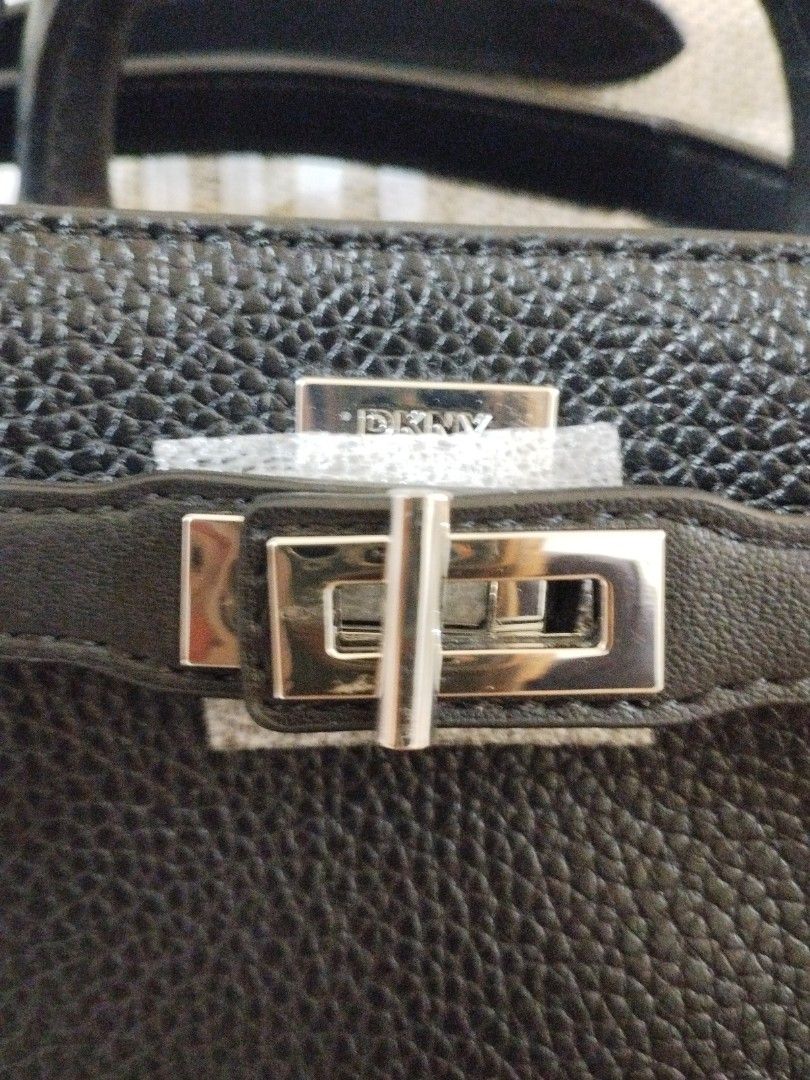 DKNY Onya crossbody bag (Category: Luxury Bags & Wallets) located in Caloocan City. Submitted by shopaholic_cousins (Listing ID 1470876675, Image 2). Description: - Brand: DKNY - Material: Black pebbled faux leather with silver hardware - Condition: Brand new with original Marshalls tag still attached - Closure: Secure twist-lock front flap - Carrying Options: Double top handles & adjustable/removable shoulder strap - Interior: Signature logo lin