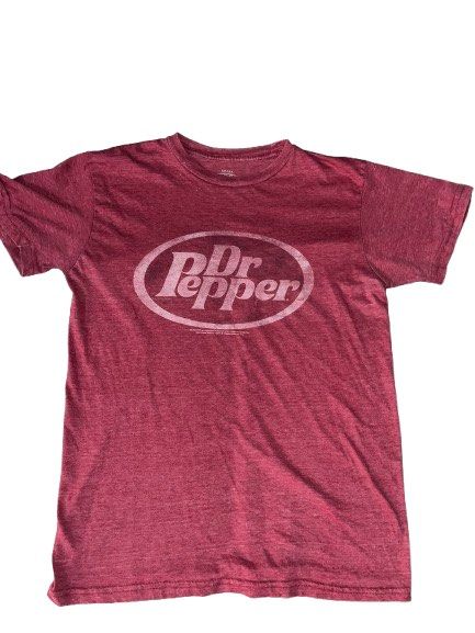 Dr Pepper Distressed Graphic T-Shirt Maroon Small (Category: Tshirts & Polo Shirts ) located in Cebu City. Submitted by cjayyythriftzzz (Listing ID 1470835245, Image 1). Description: - Color: Maroon with a distressed white Dr Pepper chest logo - Material: Comfortable cotton blend fabric - Fit & Feel: Super soft with a normal vintage wash fade - Design: Short sleeves and classic crew neckline - Condition: Tagless collar for extra comfort.