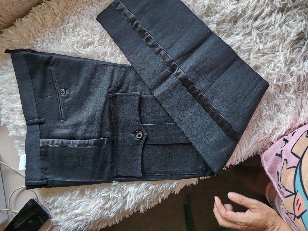 DSQUARED2 Black Tuxedo Trousers Size 48 (Category: Trousers) located in Caba. Submitted by valerie_18947 (Listing ID 1470777922, Image 3). Description: - Brand: DSQUARED2 - Size: 48 (Made in Italy by Staff International) - Style: Black tuxedo trousers with satin side stripes and front pocket detailing - Closure: Button fly - Condition: Clean fabric with clear, authentic inner tags - Ideal for formal wear, parties, and special occasions original p