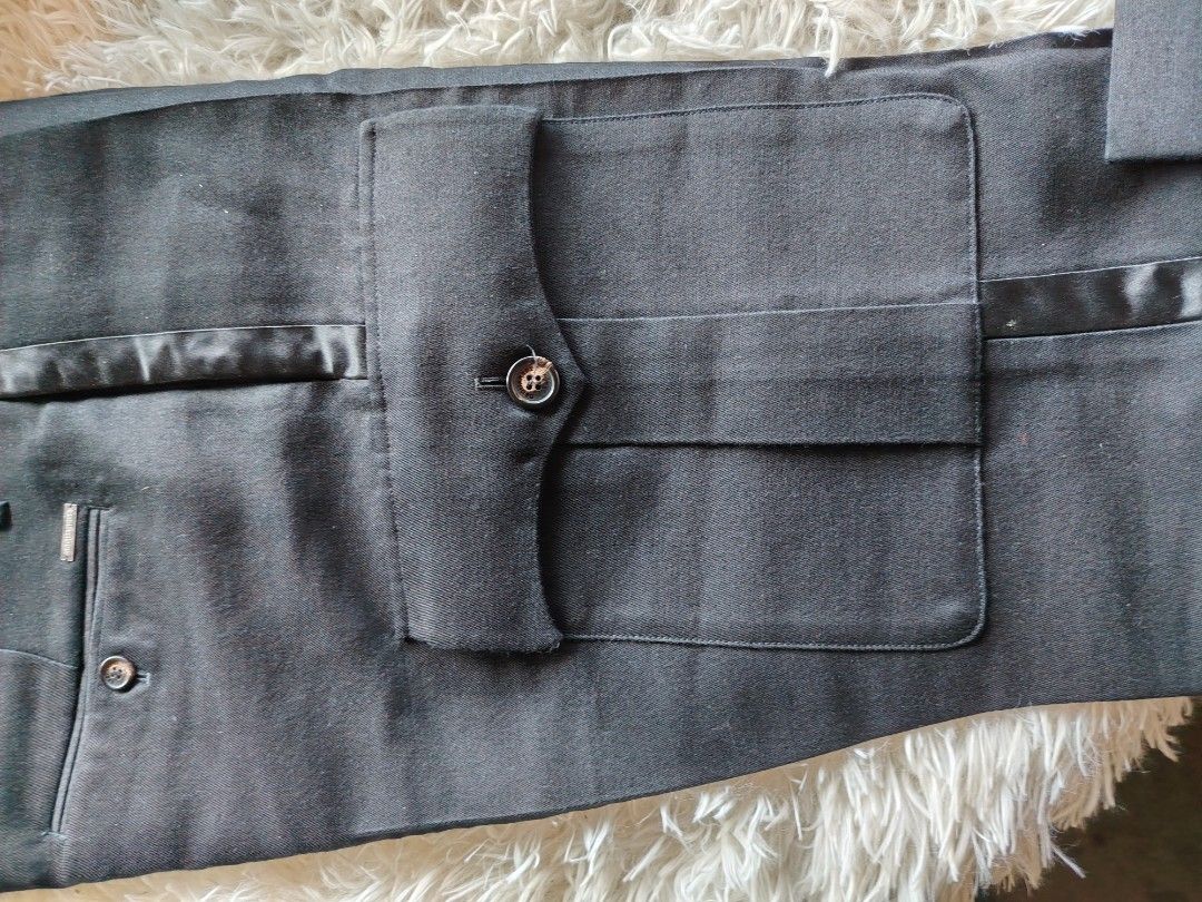 DSQUARED2 Black Tuxedo Trousers Size 48 (Category: Trousers) located in Caba. Submitted by valerie_18947 (Listing ID 1470777922, Image 2). Description: - Brand: DSQUARED2 - Size: 48 (Made in Italy by Staff International) - Style: Black tuxedo trousers with satin side stripes and front pocket detailing - Closure: Button fly - Condition: Clean fabric with clear, authentic inner tags - Ideal for formal wear, parties, and special occasions original p