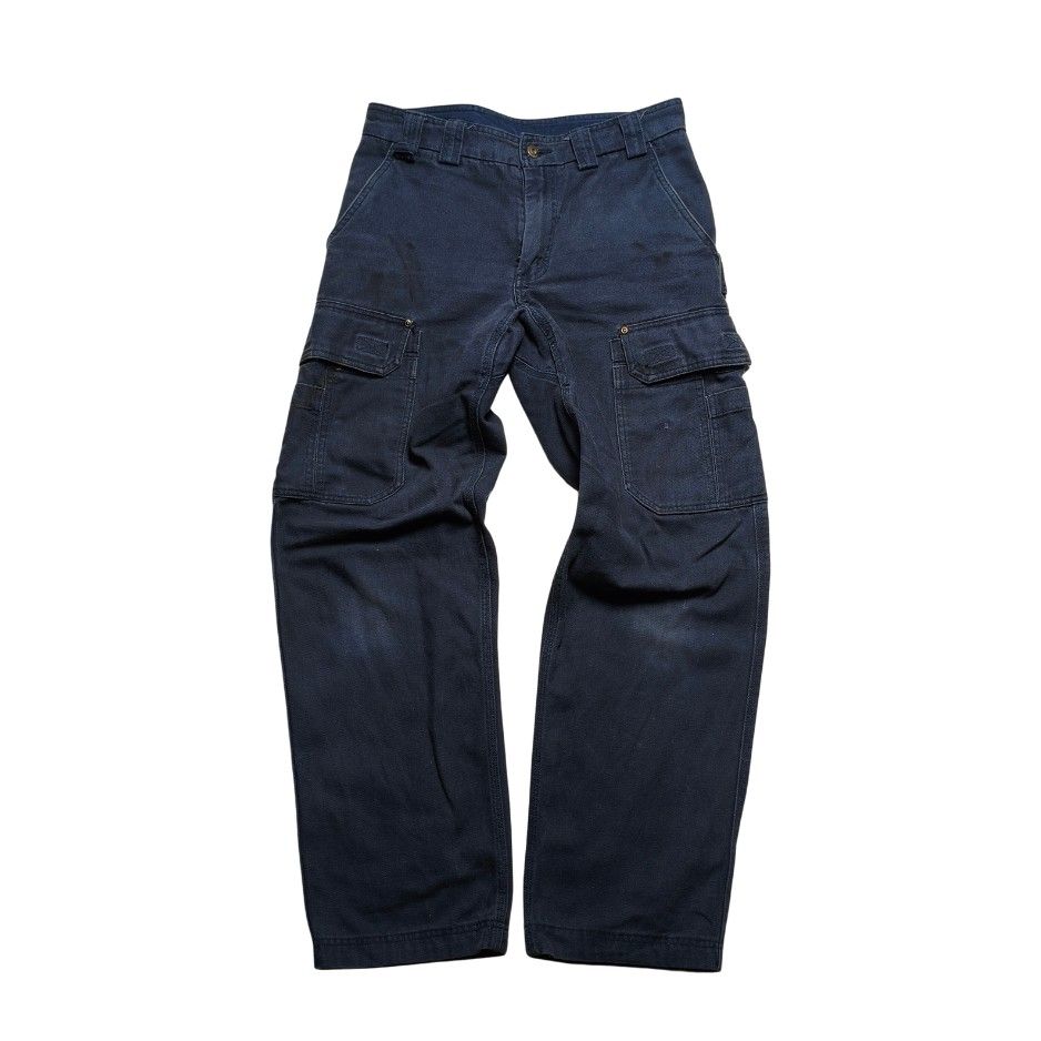 Duluth Trading Co. Dark Navy Cargo Work Pants with Multiple Pockets (Category: Jeans) located in Meycauayan. Submitted by thrifting_gorilla (Listing ID 1470887271, Image 1). Description: Duluth Trading Co. Dark Navy Cargo Work Pants with Multiple Pockets - Color: Dark navy blue - Material: Thick woven canvas fabric with slight fading and natural wear marks - Style: Rugged workwear - Pockets: Multiple utility pockets on both legs and back patch po