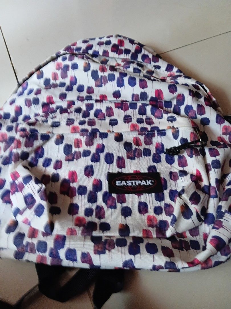 Eastpak Printed Pattern Backpack (Category: Backpacks) located in Tacurong. Submitted by choiceitems (Listing ID 1470784019, Image 1). Description: - Authentic Eastpak backpack with a unique white base and colorful abstract dot pattern - Spacious main compartment ideal for school, travel, or daily commuting - Convenient front zipped pocket with a black zipper pull for quick-access items - Comfortable, adjustable black shoulder straps for a custom