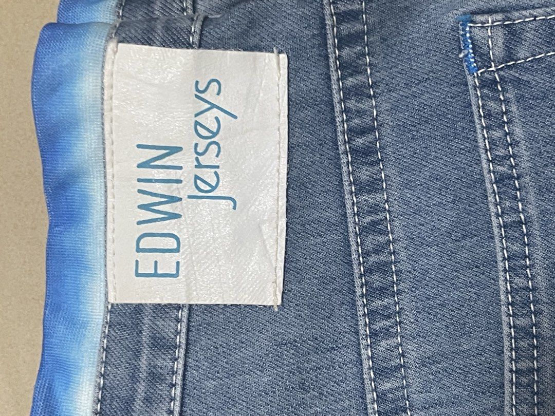 Edwin Jerseys Blue Denim Jeans (Category: Jeans) located in Davao. Submitted by rcgulanes.moon (Listing ID 1470880306, Image 2). Description: - Brand: Edwin Jerseys - Material: Comfortable stretch jersey denim - Waistband: Elasticated with adjustable blue and white tie-dye drawstring - Design: Classic five-pocket style with back pocket stitching and logo tag - Style: Versatile and easy to style for casual everyday wear.