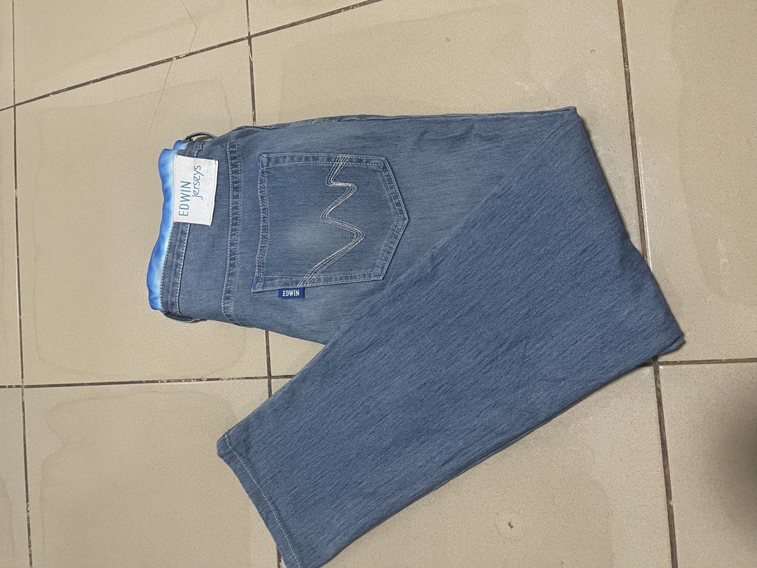 Edwin Jerseys Blue Denim Jeans (Category: Jeans) located in Davao. Submitted by rcgulanes.moon (Listing ID 1470880306, Image 3). Description: - Brand: Edwin Jerseys - Material: Comfortable stretch jersey denim - Waistband: Elasticated with adjustable blue and white tie-dye drawstring - Design: Classic five-pocket style with back pocket stitching and logo tag - Style: Versatile and easy to style for casual everyday wear.