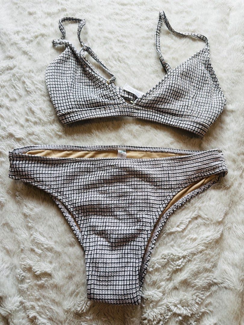 Eighth Mermaid Black White Grid Bikini Set Size M (Category: Bikinis & Swimsuits) located in Marikina City. Submitted by zarahlovestoshop (Listing ID 1470795941, Image 1). Description: - Brand: Eighth Mermaid - Style: Two-piece bikini set (bralette top + matching bottoms) - Fabric: Black & white grid textured crinkle fabric with nude full lining - Details: Adjustable straps, gold hardware on back clasp and straps - Size: Medium (M) -SF c/o buyer 