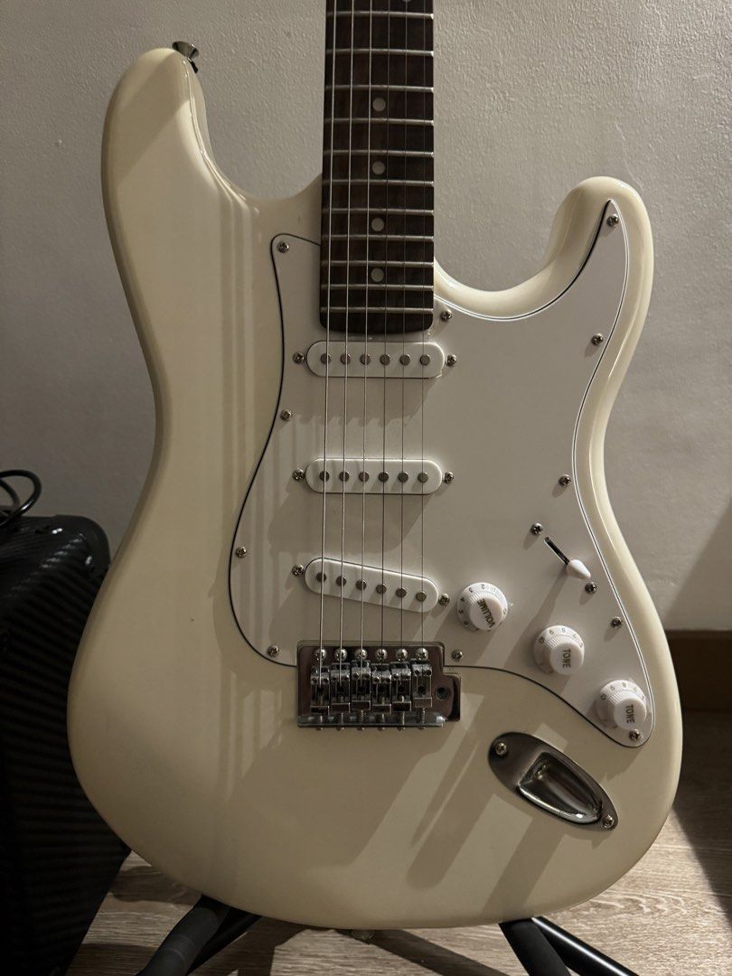 Electric Guitar and Marshall Amplifier Bundle (Category: Musical Instruments) located in Paranaque City. Submitted by jennifer_18 (Listing ID 1470899099, Image 2). Description: - Complete Electric Guitar Set -Amplifier: Marshall MG10CF 10-watt with carbon fiber finish - Classic white Stratocaster-style body, rosewood fretboard, white pickguard, 3 single-coil pickups, 1 volume, 2 tone knobs, and a 5-way pickup selector - Condition: Excellent worki
