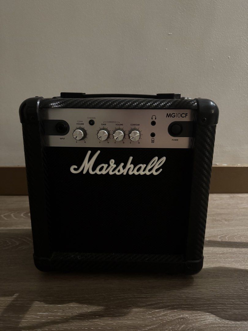 Electric Guitar and Marshall Amplifier Bundle (Category: Musical Instruments) located in Paranaque City. Submitted by jennifer_18 (Listing ID 1470899099, Image 3). Description: - Complete Electric Guitar Set -Amplifier: Marshall MG10CF 10-watt with carbon fiber finish - Classic white Stratocaster-style body, rosewood fretboard, white pickguard, 3 single-coil pickups, 1 volume, 2 tone knobs, and a 5-way pickup selector - Condition: Excellent worki