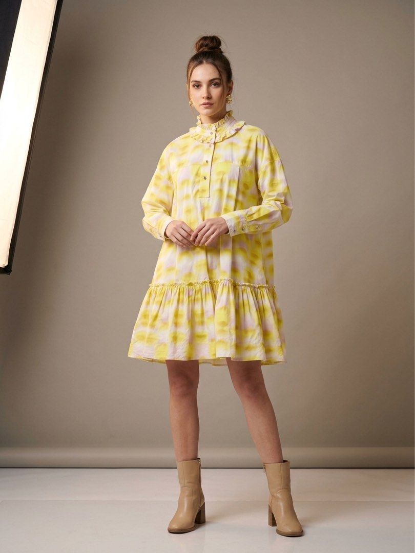 Elegant Yellow Ruffled Dress (Category: Dresses) located in Manila. Submitted by morningthrifters (Listing ID 1470764403, Image 1). Description: Brand: Broadcast from Hongkong 📝Yellow Draped Mini Dress with Ruffle Detail in a yellow tie-dye or printed pattern, styled with a high ruffled collar, front button placket, long sleeves, and a tiered drop-waist hem. 📐 Size Medium 💗 Second time buyers has a free item, follow me to get updated. ⚠️ Pleas