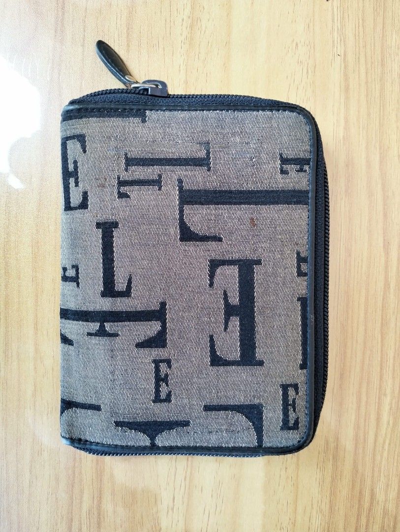 ELLE Paris Monogram Zip Around Wallet (Category: Wallets & Card holders) located in Baguio. Submitted by bagnpouchbuddies (Listing ID 1470908501, Image 1). Description: Loc. Baguio MoP: Gcash MoD: JnT - Authentic ELLE Paris monogram canvas wallet with chic black trim - Secure zip-around closure featuring a convenient fabric pull tab - Premium dark navy leather interior with embossed ELLE logo - Multiple card slots, an ID window, and a spacious bi