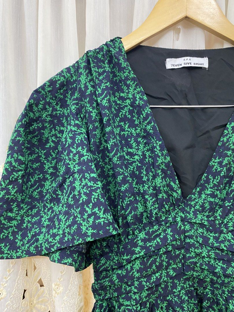 Emerald Green Midi Dress (Category: Dresses) located in Trece Martires City. Submitted by reloveandrestyle (Listing ID 1470856282, Image 3). Description: -Midi Dress -Fit to S-M -Super classy and elegant -V-neckline, flutter sleeves -a ruched/shirred empire waistline, -botanical print over a black base..