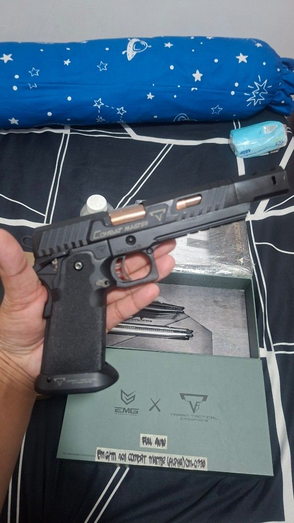 EMG Taran Tactical Innovations Combat Master Airsoft Pistol (Category: Combat Sports) located in Cavite. Submitted by ambon2022 (Listing ID 1470930137, Image 3). Description: - Model: EMG Taran Tactical Innovations Combat Master (Alpha box) - Condition: Fully functional with realistic blowback action - Complete Package: Includes original green box, extra magazines, and holster - Extras: Tools, BBs, and a plastic-wrapped target stand included - Pe