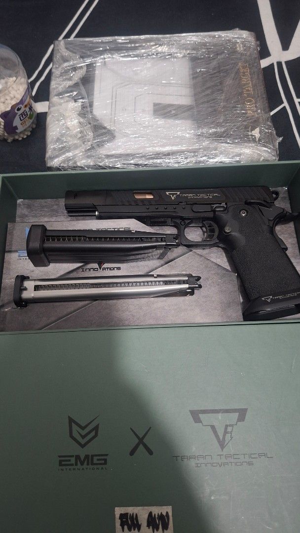 EMG Taran Tactical Innovations Combat Master Airsoft Pistol (Category: Combat Sports) located in Cavite. Submitted by ambon2022 (Listing ID 1470930137, Image 2). Description: - Model: EMG Taran Tactical Innovations Combat Master (Alpha box) - Condition: Fully functional with realistic blowback action - Complete Package: Includes original green box, extra magazines, and holster - Extras: Tools, BBs, and a plastic-wrapped target stand included - Pe