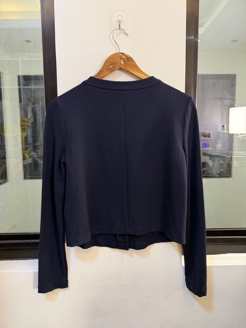 Emporio Armani Button-Down Collarless Cardigan Jacket (Category: Coats, Jackets and Outerwear) located in Paranaque City. Submitted by preluxeshop_ph (Listing ID 1470809777, Image 3). Description: Brand: Emporio Armani -Style: Button-Down Collarless Cardigan Jacket / Long-Sleeve Knit Top -Color: Dark Navy Blue -Design Features: Clean collarless crew neckline, matching fabric-covered front buttons, fitted long sleeves, and vertical seam detailing 