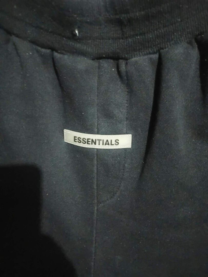 Essentials Black Zipper Shorts (Category: Shorts) located in Angeles City. Submitted by ukaythrift2.0 (Listing ID 1470877240, Image 2). Description: - Color: Classic Black - Material: Premium heavy cotton fleece for ultimate comfort and warmth - Features: Elastic waistband for a secure fit and convenient zippered pockets on both sides - Branding: Centered rubberized Essentials logo patch - Condition: Clean, well-maintained overall - Perfect for d
