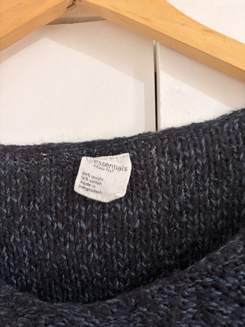 Essentials by Full Tilt Knit Sweater Dark Charcoal (Category: Longsleeves) located in Marikina City. Submitted by _bananahanaa (Listing ID 1470770221, Image 2). Description: - Brand: Essentials by Full Tilt - Color: Dark grey - Material: 84% acrylic, 16% cotton (Made in Bangladesh) - Design: Wide neckline, long sleeves, ribbed hem, high-low hemline - Condition/Style: Cozy everyday piece, super easy to pair with jeans.