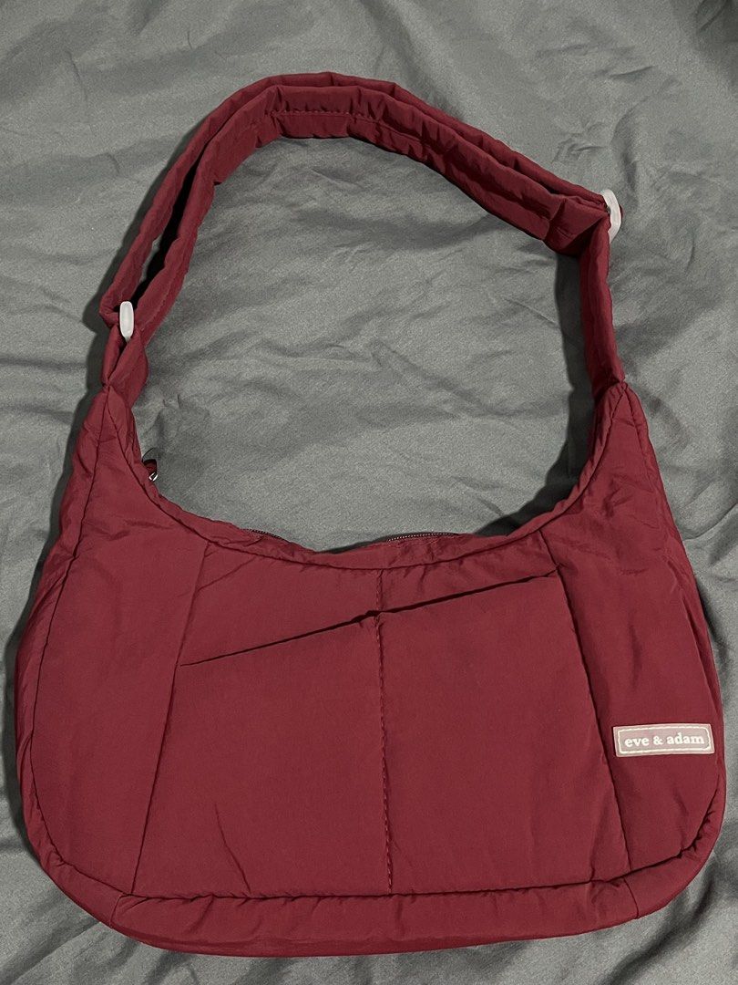 Eve & Adam Cali Puffer Bag Small in Maroon (Category: Cross-body Bags) located in Bulacan. Submitted by love.aya (Listing ID 1470801181, Image 2). Description: Eve & Adam Cali Puffer Bag Small Water-resistant, spacious, durable and packed with multiple pockets for all your essentials. - Color: Maroon - Material: Padded premium water-resistant nylon - Exterior: zipper closure, front pocket, back pocket - Interior: water-resistant lining, 1 zipper 