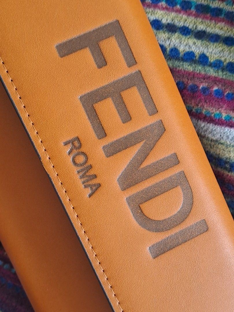 Fendi Roma Long Wallet (Category: Wallets & Card holders) located in Narra. Submitted by jervs29corner (Listing ID 1470833680, Image 2). Description: - Brand/Model: Fendi Roma Wallet - Closure: Flap with secure snap button - Interior Storage: Multiple card slots, spacious bill compartments, and a convenient zippered coin pocket - Details: Stamped Fendi logo inside with clean, premium stitching all around - Condition/Usage: Great daily companion t