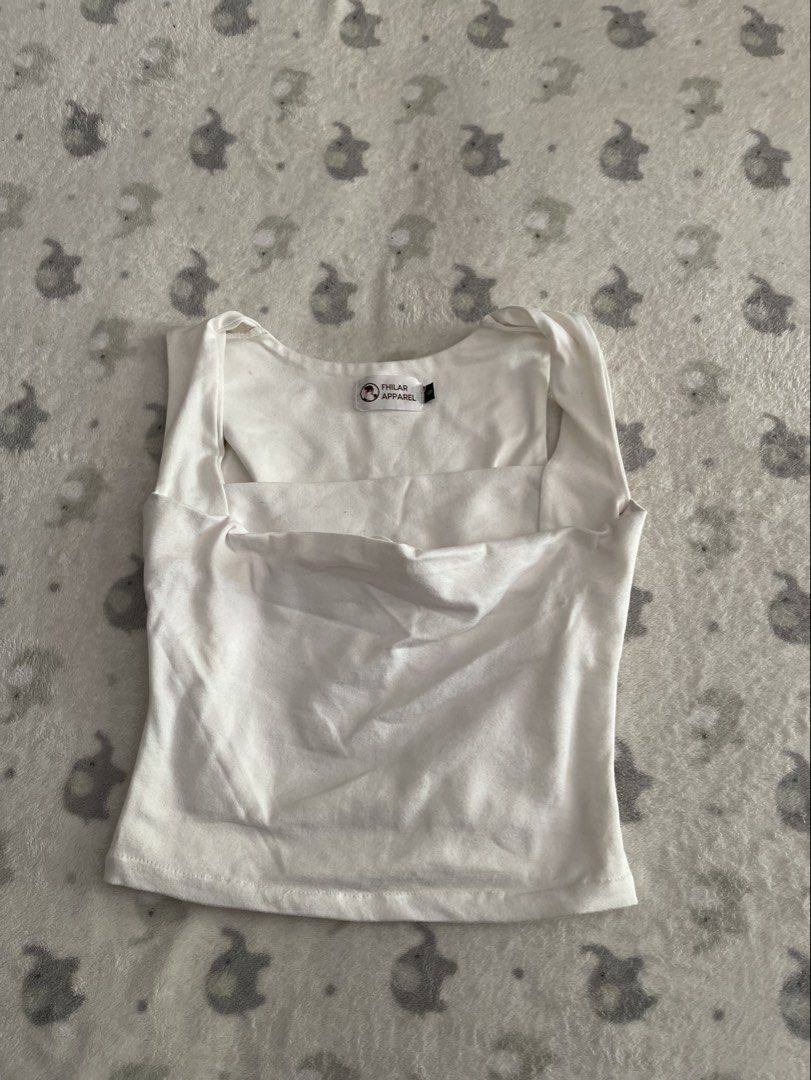 Fhilar Apparel White top (Category: Sleeveless) located in Sorsogon. Submitted by comfortbeforestyle (Listing ID 1470766624, Image 1). Description: Fhilar White Top | Small Lightly used but stored for a long time. Has some dirt marks due to storage, which may come off after washing. The fabric should look whiter once cleaned. Please manage your expectations and buy as is. Location: Sorsogon Shipping: J&T Express only..