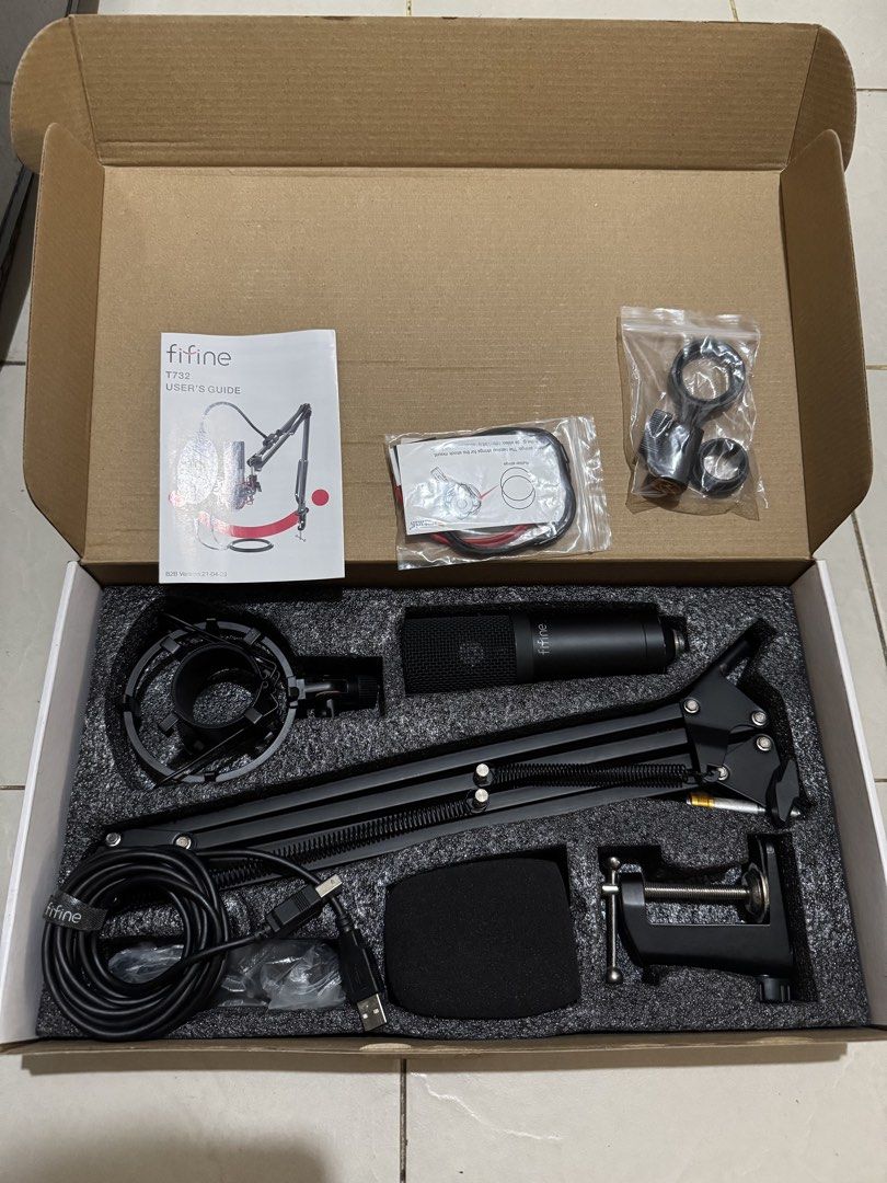 Fifine T732 Microphone Kit (Category: Microphones) located in Manila. Submitted by delapazrdee (Listing ID 1470851226, Image 2). Description: - Item: Fifine T732 Microphone Kit (Complete Set) - Condition: Brand new and unused, still in original box with protective packaging - Included: Condenser mic, adjustable boom arm, shock mount, pop filter, foam windscreen, USB cable, table clamp, and manual - Setup: Plug-and-play design, no extra drivers or