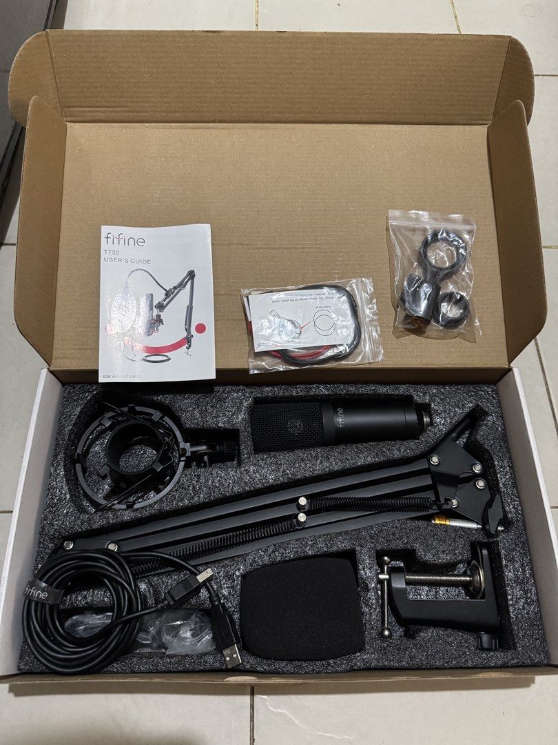 Fifine T732 Microphone Kit (Category: Microphones) located in Manila. Submitted by delapazrdee (Listing ID 1470851226, Image 3). Description: - Item: Fifine T732 Microphone Kit (Complete Set) - Condition: Brand new and unused, still in original box with protective packaging - Included: Condenser mic, adjustable boom arm, shock mount, pop filter, foam windscreen, USB cable, table clamp, and manual - Setup: Plug-and-play design, no extra drivers or