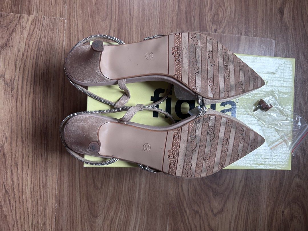 Figlia Fergie Beige Kitten Heels Size 39 (Category: Heels) located in Bacoor. Submitted by Claudine (Listing ID 1470822403, Image 3). Description: - Brand/Model: Figlia Fergie Heels - Color/Material: Beige Suede - Size: 39 - Style: Pointed toe with sparkly rhinestone ankle and foot straps, kitten heel - Inclusions: Original yellow box and extra heel tips - Condition: Soles show wear from previous use USED ONLY ONCE.
