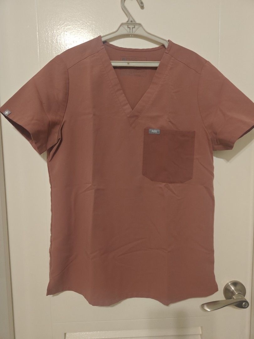 FIGS Technical Collection Scrubs Set Small Mauve (Category: Sets or Coordinates) located in Quezon City. Submitted by capyboora (Listing ID 1470862329, Image 1). Description: - Brand: FIGS (Technical Collection) - Size: Small - Color: Dusty Pink / Mauve - Top: Short-sleeve V-neck with chest pocket - Bottoms: Matching jogger pants with drawstring waist and multiple pockets - Condition: Excellent, clean, no stains or damage - Fabric: Super comforta