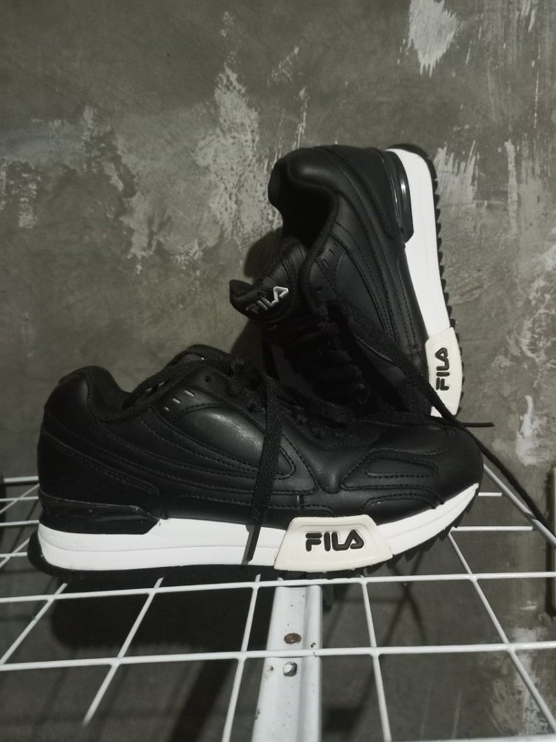 Fila Black Sneakers Size US 4 (Category: Sneakers) located in Mabalacat. Submitted by hasashoe (Listing ID 1470821502, Image 1). Description: - Brand: Fila - Model: FS1RIB3292X-BLK - Color: Black with chunky white soles - Size: US 4 / EUR 36.5 / UK 3 - Materials: Leather and synthetic upper, textile lining, EVA rubber sole - Origin: Made in Vietnam - Condition: Excellent, clean soles and treads with minimal wear on bottom grips.
